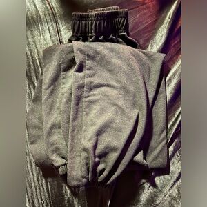 Baggy, black sweatpants.